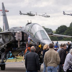 Four Gazelle helicopters fly past with a black Jaguar in the foreground.
The RAF Cosford Airshow, Sunday 9th June 2024 is the primary airshow of the Royal Air Force attracting in excess of 55,000 visitors it is one of the biggest events in the West Midlands. This Years theme was ‘Take Flight’ with displays, events and activities aiming to drive potential new recruits to kickstart their interest of a career in the RAF and develop an understanding of what the British Military, Allied Forces and Sister Services do for the defence of the United Kingdom. Visitors are able to get close to the cutting edge of technology with RAF Aircraft and unique attractions across the show ground and immerse themselves in a thrilling action-packed flying display programme.
The RAF Cosford Airshow is an excellent way for the Ministry of Defence to engage with the public and showcase the Royal Air Force’s capabilities and to celebrate the service’s history while looking ahead to the next generation of people and technology.
RAF Cosford in Shropshire is a major part of the Defence College of Technical Training (DCTT). It is at the centre of the RAF’s mission to deliver flexible, affordable, modern and effective technical training that meets the needs of the UK’s Armed Forces now and into the future. RAF Apprenticeships delivered at RAF Cosford were recently recognised as ‘Outstanding’ by Ofsted. RAF Cosford is also home to the popular RAF Museum and the world-renowned Cosford Airshow.