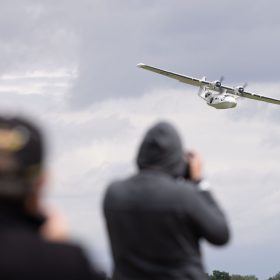 Visitors watch the flypast of a Catalina.
The RAF Cosford Airshow, Sunday 9th June 2024 is the primary airshow of the Royal Air Force attracting in excess of 55,000 visitors it is one of the biggest events in the West Midlands. This Years theme was ‘Take Flight’ with displays, events and activities aiming to drive potential new recruits to kickstart their interest of a career in the RAF and develop an understanding of what the British Military, Allied Forces and Sister Services do for the defence of the United Kingdom. Visitors are able to get close to the cutting edge of technology with RAF Aircraft and unique attractions across the show ground and immerse themselves in a thrilling action-packed flying display programme.
The RAF Cosford Airshow is an excellent way for the Ministry of Defence to engage with the public and showcase the Royal Air Force’s capabilities and to celebrate the service’s history while looking ahead to the next generation of people and technology.
RAF Cosford in Shropshire is a major part of the Defence College of Technical Training (DCTT). It is at the centre of the RAF’s mission to deliver flexible, affordable, modern and effective technical training that meets the needs of the UK’s Armed Forces now and into the future. RAF Apprenticeships delivered at RAF Cosford were recently recognised as ‘Outstanding’ by Ofsted. RAF Cosford is also home to the popular RAF Museum and the world-renowned Cosford Airshow.