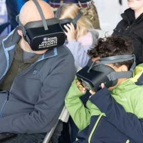 The RAF Cosford Air show, Sunday 8th June 2025 is the primary air show of the Royal Air Force attracting in excess of 55,000 visitors it is one of the biggest events in the West Midlands. This Years theme is ‘Commemorate, Celebrate, Innovate’. The air show will commemorate some of our history both in terms of assets and through displays in the Victory Village; Celebrate the work of the Royal Air Force, NATO Allies and Partner nations; And seek to inspire the next generation by showcasing how the armed forces innovate together and with our Defence sector partners in the STEM Hangar.
With displays, events and activities aiming to drive potential new recruits to kickstart their interest of a career in the RAF and develop an understanding of what the British Military, Allied Forces and Sister Services do for the defence of the United Kingdom. Visitors are able to get close to the cutting edge of technology with RAF Aircraft and unique attractions across the show ground and immerse themselves in a thrilling action-packed flying display programme.
The RAF Cosford Air show is an excellent way for the Ministry of Defence to engage with the public and showcase the Royal Air Force’s capabilities and to celebrate the service’s history while looking ahead to the next generation of people and technology.
RAF Cosford in Shropshire is a major part of the Defence College of Technical Training (DCTT). It is at the centre of the RAF’s mission to deliver flexible, affordable, modern and effective technical training that meets the needs of the UK’s Armed Forces now and into the future. RAF Apprenticeships delivered at RAF Cosford were recently recognised as ‘Outstanding’ by Ofsted. RAF Cosford is also home to the popular RAF Museum and the world-renowned Cosford Air show.
RAF Cosford opened in 1938 and is the home of RAF Engineering. The station currently trains all of the RAF’s Aircraft Technicians (Mechanical, Avionics, Weapons and Survival Equipment), Cybe